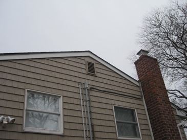 side of house before mold remediation in attic